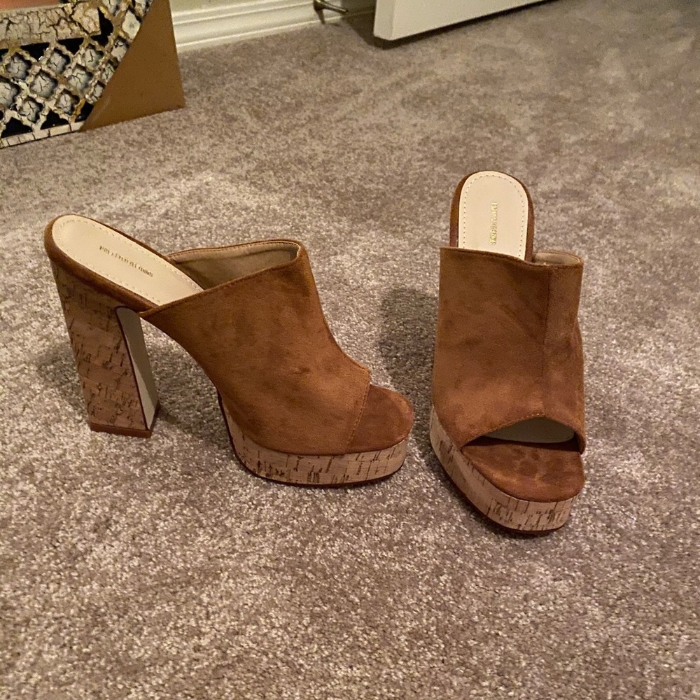 Suede heels. Never worn.